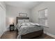 Comfortable bedroom with a rustic wooden bed frame and soft, neutral bedding at 124 Birch N Coppice Dr. # 1, Surfside Beach, SC 29575