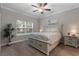 Cozy bedroom with carpet, ceiling fan, full-sized bed, and natural light at 124 Birch N Coppice Dr. # 1, Surfside Beach, SC 29575