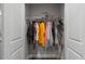 Open closet with hanging clothes at 124 Birch N Coppice Dr. # 1, Surfside Beach, SC 29575