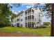 Beautiful exterior view of the building and screened in patios at 124 Birch N Coppice Dr. # 1, Surfside Beach, SC 29575