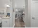 Hallway view to a restroom, living room and kitchen at 124 Birch N Coppice Dr. # 1, Surfside Beach, SC 29575