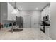 Well-lit kitchen featuring white cabinets, granite counters, and stainless steel appliances at 124 Birch N Coppice Dr. # 1, Surfside Beach, SC 29575