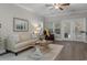 Comfortable living room with patio doors, hardwood floors, decor, ceiling fan at 124 Birch N Coppice Dr. # 1, Surfside Beach, SC 29575