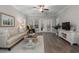 Bright living room with patio doors, hardwood floors, decor, ceiling fan at 124 Birch N Coppice Dr. # 1, Surfside Beach, SC 29575