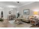 Bright living room with hardwood floors, decor, ceiling fan, and dining area at 124 Birch N Coppice Dr. # 1, Surfside Beach, SC 29575