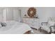 Neutral bedroom featuring a dresser, mirror, decorative chair, and wood-look floors at 1402 Nokota Dr., Conway, SC 29526