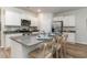 Stylish kitchen with white cabinets, stainless steel appliances, and a granite-topped island with seating at 1402 Nokota Dr., Conway, SC 29526
