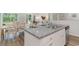 Open-concept kitchen featuring granite countertops and stainless steel sink with a dining area view at 1402 Nokota Dr., Conway, SC 29526