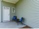 Cozy front porch with two chairs and small table at 1442 Nokota Dr., Conway, SC 29526