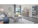 Bright living room with lots of natural light, stylish furnishings, and view of a lake at 1442 Nokota Dr., Conway, SC 29526