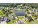 Aerial view of lovely homes surrounding a serene pond with lush green landscaping at 1455 Whooping Crane Dr., Conway, SC 29526