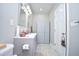 Bright bathroom featuring a double sink vanity with modern fixtures and a built in cabinet at 1455 Whooping Crane Dr., Conway, SC 29526