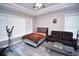 Bedroom with a bed, sofa, exercise equipment, and a West Virginia Mountaineers logo at 1455 Whooping Crane Dr., Conway, SC 29526