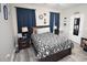 Comfortable bedroom featuring a patterned duvet, side tables, and nautical decor at 1455 Whooping Crane Dr., Conway, SC 29526