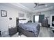 Well-lit bedroom with a platform bed, dresser, and modern decor at 1455 Whooping Crane Dr., Conway, SC 29526