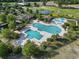 Aerial view of a large community pool with ample seating and meticulously maintained landscaping at 1455 Whooping Crane Dr., Conway, SC 29526