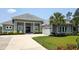 Stunning single-story home with a well-manicured lawn and an attached two-car garage at 1455 Whooping Crane Dr., Conway, SC 29526