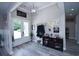 Inviting foyer with light gray plank flooring, white trim, and decorative wall decor at 1455 Whooping Crane Dr., Conway, SC 29526