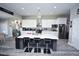 Spacious kitchen featuring a large island with seating, white cabinets, and stainless steel appliances at 1455 Whooping Crane Dr., Conway, SC 29526