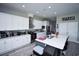 Bright kitchen with white cabinets, marble countertops, stainless steel appliances, and a large island at 1455 Whooping Crane Dr., Conway, SC 29526