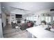 Open concept living room with modern furniture, fireplace, and large windows with views of the backyard at 1455 Whooping Crane Dr., Conway, SC 29526