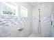 Tiled shower with a mosaic accent stripe, rainfall shower head, and built-in niche at 1455 Whooping Crane Dr., Conway, SC 29526