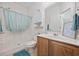 Cozy bathroom with oak vanity, shower and bath combination, and decorative accents at 155 Chenoa Dr. # D, Murrells Inlet, SC 29576
