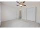 Spacious bedroom with ample closet space and neutral carpet, offering comfort and storage at 155 Chenoa Dr. # D, Murrells Inlet, SC 29576