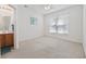 Bright bedroom with natural light, a ceiling fan, and view to ensuite bathroom at 155 Chenoa Dr. # D, Murrells Inlet, SC 29576