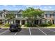 Charming townhome with well-maintained landscaping and convenient parking for a welcoming curb appeal at 155 Chenoa Dr. # D, Murrells Inlet, SC 29576