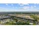 Aerial view of a beautiful community with mature trees, ponds and multiple pools at 155 Chenoa Dr. # E, Murrells Inlet, SC 29576