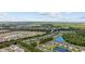 Aerial view of a beautiful community with mature trees, ponds and multiple pools at 155 Chenoa Dr. # E, Murrells Inlet, SC 29576