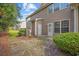 Backyard exterior view features tidy landscaping with patio and access doors at 155 Chenoa Dr. # E, Murrells Inlet, SC 29576