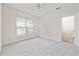 Bedroom with natural light, carpeted floors, and a view of the entrance at 155 Chenoa Dr. # E, Murrells Inlet, SC 29576