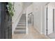 Bright foyer with tiled floor, staircase, and natural light from the doorway ahead at 155 Chenoa Dr. # E, Murrells Inlet, SC 29576