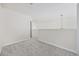 Spacious upstairs hallway with neutral carpet and walls, illuminated by overhead lighting at 155 Chenoa Dr. # E, Murrells Inlet, SC 29576