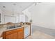 Kitchen featuring wood cabinetry, stainless steel sink and white appliances at 155 Chenoa Dr. # E, Murrells Inlet, SC 29576