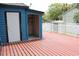 A large backyard deck featuring a built-in storage space, perfect for outdoor entertaining at 1557 Elizabeth Rd., Myrtle Beach, SC 29577