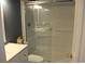 Bathroom featuring shower-tub combination with sliding glass doors and updated vanity at 1557 Elizabeth Rd., Myrtle Beach, SC 29577