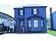 Charming blue two-story home with an American flag and manicured landscaping at 1557 Elizabeth Rd., Myrtle Beach, SC 29577