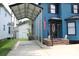 Lovely blue home featuring a carport and a well-maintained front yard at 1557 Elizabeth Rd., Myrtle Beach, SC 29577