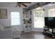 Bright living room with hardwood floors, lots of light, and fun decorations at 1557 Elizabeth Rd., Myrtle Beach, SC 29577