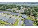 An aerial view featuring homes in a picturesque coastal neighborhood, with lush lawns near a beautiful waterway at 1584 Sand Harbor Cir. # 1584, Ocean Isle Beach, NC 28469