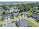 A bird's eye view highlighting the well-manicured lawns and beautiful homes in a scenic, upscale coastal community at 1584 Sand Harbor Cir. # 1584, Ocean Isle Beach, NC 28469