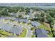 An aerial view featuring homes in a picturesque coastal neighborhood, with lush lawns near a beautiful waterway at 1584 Sand Harbor Cir. # 1584, Ocean Isle Beach, NC 28469