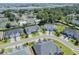 A bird's eye view highlighting the well-manicured lawns and beautiful homes in a scenic, upscale coastal community at 1584 Sand Harbor Cir. # 1584, Ocean Isle Beach, NC 28469
