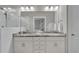 Elegant bathroom featuring double sinks, marble countertops, subway tile, and glass shower at 1584 Sand Harbor Cir. # 1584, Ocean Isle Beach, NC 28469