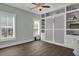 Spacious bedroom with hardwood floors and custom built in shelving and cabinets at 1584 Sand Harbor Cir. # 1584, Ocean Isle Beach, NC 28469