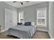 Cozy bedroom with neutral tones, shutters on windows and a ceiling fan at 1584 Sand Harbor Cir. # 1584, Ocean Isle Beach, NC 28469