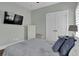 Comfortable bedroom featuring a television, dresser and muted colors at 1584 Sand Harbor Cir. # 1584, Ocean Isle Beach, NC 28469